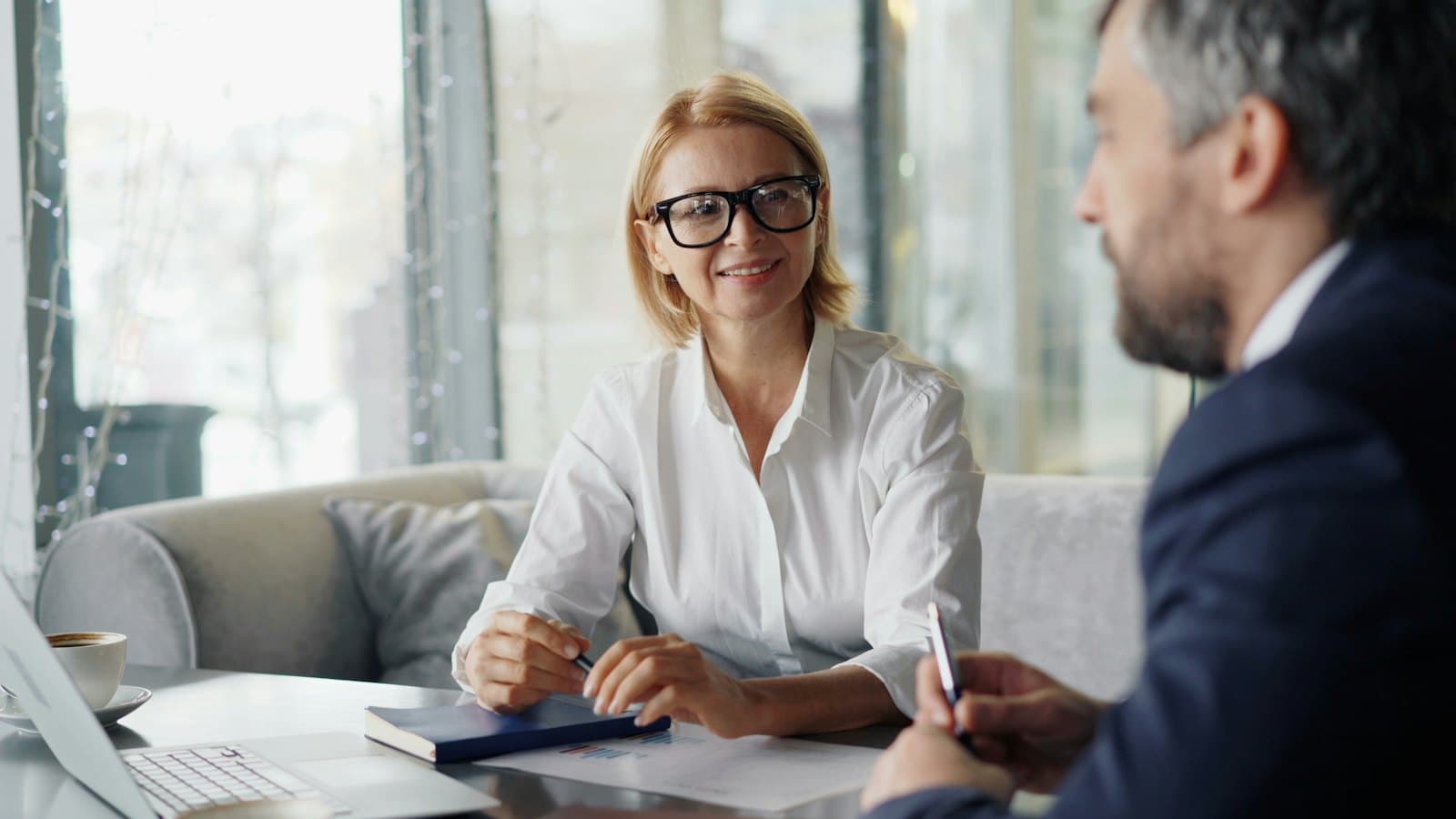 A partner reviewing figures with a client